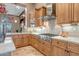 Gourmet kitchen featuring stainless steel appliances and custom cabinets at 42023 N Bridlewood Way, Anthem, AZ 85086