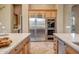 Spacious kitchen with stainless steel appliances, custom cabinetry, and marble countertops at 42023 N Bridlewood Way, Anthem, AZ 85086