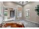 Bright living space with large windows, neutral carpet, and a glimpse into the foyer at 42023 N Bridlewood Way, Anthem, AZ 85086