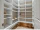 Organized pantry with custom shelving, wine storage, providing ample space at 42023 N Bridlewood Way, Anthem, AZ 85086
