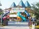 Community adventure playground with slides and railway crossing themed features at 42023 N Bridlewood Way, Anthem, AZ 85086