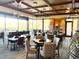 Restaurant with large windows, ample seating, and views of the community's golf course at 42023 N Bridlewood Way, Anthem, AZ 85086