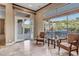 Bright sitting area features tile flooring, plush chairs, and large windows overlooking the outdoor space at 42023 N Bridlewood Way, Anthem, AZ 85086