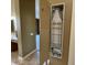 A convenient hideaway ironing board closet provides space-saving functionality in the home at 42023 N Bridlewood Way, Anthem, AZ 85086
