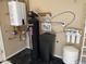 Image of a home water filtration and heating system with a modern water heater and black water purification system at 42023 N Bridlewood Way, Anthem, AZ 85086