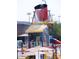 splashpad with colorful water bucket and playful features in a community waterpark at 42023 N Bridlewood Way, Anthem, AZ 85086