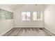Cozy bedroom featuring wood floors, neutral walls, and bright windows, providing a serene atmosphere at 4901 S Calle Los Cerros Dr # 220, Tempe, AZ 85282