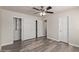Bedroom featuring wood floors and closet doors, offering a practical and comfortable living space at 4901 S Calle Los Cerros Dr # 220, Tempe, AZ 85282