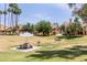 Beautiful community area with picnic tables, umbrellas, and lush green grass at 4901 S Calle Los Cerros Dr # 220, Tempe, AZ 85282