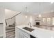 Elegant kitchen features an island with sink, steps away from a cozy living area with fireplace at 4901 S Calle Los Cerros Dr # 220, Tempe, AZ 85282