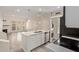 Open concept kitchen features modern appliances, quartz countertops, and a seamless connection to the living area at 4901 S Calle Los Cerros Dr # 220, Tempe, AZ 85282