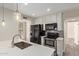 Well-lit kitchen features quartz countertops, stainless steel appliances, and ample storage space at 4901 S Calle Los Cerros Dr # 220, Tempe, AZ 85282