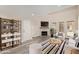 Bright living room features a decorative fireplace, modern furnishings, and ample natural light at 4901 S Calle Los Cerros Dr # 220, Tempe, AZ 85282