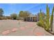 Backyard showcasing low-maintenance desert landscaping, gravel, and paved pathway with desert plants at 5133 E Keresan St, Phoenix, AZ 85044