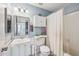 Bathroom featuring white vanity and fixtures against blue walls, offering a clean and functional space at 5133 E Keresan St, Phoenix, AZ 85044