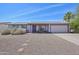 Charming single-story home with low-maintenance landscaping and attached two-car garage at 5133 E Keresan St, Phoenix, AZ 85044