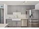 Updated kitchen featuring stainless steel appliances and sleek countertops at 5133 E Keresan St, Phoenix, AZ 85044