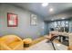 Finished basement with workspace, artwork, and neutral decor at 5556 E Sandra Ter, Scottsdale, AZ 85254