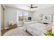 Bright bedroom offers a ceiling fan, large window, and mirrored vanity at 5556 E Sandra Ter, Scottsdale, AZ 85254