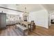 Spacious dining room with a long wooden table and seating, perfect for entertaining at 5556 E Sandra Ter, Scottsdale, AZ 85254