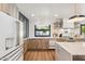 Bright kitchen with stainless steel appliances, white countertops, and wood cabinets at 5556 E Sandra Ter, Scottsdale, AZ 85254