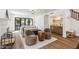 Stylish living room featuring a wet bar, comfortable seating, and backyard view at 5556 E Sandra Ter, Scottsdale, AZ 85254