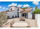 An expansive patio with a daybed and dining table, perfect for outdoor entertaining and relaxation at 5556 E Sandra Ter, Scottsdale, AZ 85254