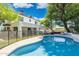 Beautiful backyard with a sparkling pool, secure fencing, and lush greenery at 5556 E Sandra Ter, Scottsdale, AZ 85254
