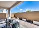 Cozy backyard patio with seating, brick pavers, fire pit, and privacy wall, perfect for outdoor living at 651 N Bay Dr, Gilbert, AZ 85233
