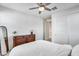 Bedroom with a ceiling fan, a closet, and view of a hallway at 651 N Bay Dr, Gilbert, AZ 85233