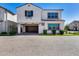 Inviting two-story home with a garage, attractive landscaping, and a paved driveway at 651 N Bay Dr, Gilbert, AZ 85233