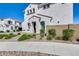 Inviting two-story home with a landscaped front yard and a private side yard at 651 N Bay Dr, Gilbert, AZ 85233