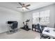 Home office featuring dual monitors, a desk, and exercise bike at 651 N Bay Dr, Gilbert, AZ 85233
