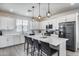 Bright kitchen with a large island, modern appliances, and stylish pendant lighting at 651 N Bay Dr, Gilbert, AZ 85233