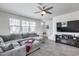Bright living room with neutral walls and a large, comfortable sectional sofa at 651 N Bay Dr, Gilbert, AZ 85233