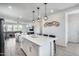 Bright, open floor plan with a kitchen island, dining area, and living space with comfortable seating at 651 N Bay Dr, Gilbert, AZ 85233