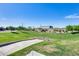 Scenic community park with lush greenery, walking path and manicured landscaping at 651 N Bay Dr, Gilbert, AZ 85233