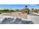 Community playground area featuring swings, slides, and climbing structures at 651 N Bay Dr, Gilbert, AZ 85233