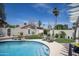Backyard pool area with manicured landscaping and patio seating, offering a serene outdoor retreat at 6732 W Sack Dr, Glendale, AZ 85308