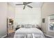 Comfortable bedroom with stylish grid accent wall and a view into the kitchen at 6732 W Sack Dr, Glendale, AZ 85308