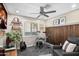 Bonus room featuring a drum set, guitar, wood paneling, and ample natural light at 6732 W Sack Dr, Glendale, AZ 85308