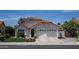 Inviting single-level home with desert landscaping, a two-car garage, and a classic Southwestern design at 6732 W Sack Dr, Glendale, AZ 85308