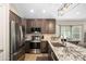 Well-equipped kitchen featuring stainless steel appliances, granite countertops, and modern fixtures for cooking convenience at 6732 W Sack Dr, Glendale, AZ 85308