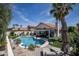 Backyard pool with a covered patio, comfortable lounge chairs, lush landscaping, and a relaxing ambiance at 6732 W Sack Dr, Glendale, AZ 85308