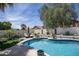 Backyard pool area featuring manicured landscaping, decorative walls, and lounge seating for outdoor enjoyment at 6732 W Sack Dr, Glendale, AZ 85308