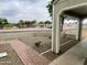 Inviting courtyard with decorative rocks, cactus, and a red brick pathway at 7026 S 40Th Pl, Phoenix, AZ 85042