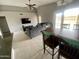 Open concept dining area with tile floors and seamlessly connected to the living room at 7026 S 40Th Pl, Phoenix, AZ 85042