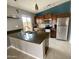 Modern kitchen featuring stainless steel appliances, tile backsplash and a breakfast bar at 7026 S 40Th Pl, Phoenix, AZ 85042