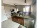 Open-concept kitchen with modern appliances and a view into the living and dining areas at 7026 S 40Th Pl, Phoenix, AZ 85042