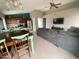Open-concept living space with seamless transitions between the kitchen, dining, and living areas at 7026 S 40Th Pl, Phoenix, AZ 85042